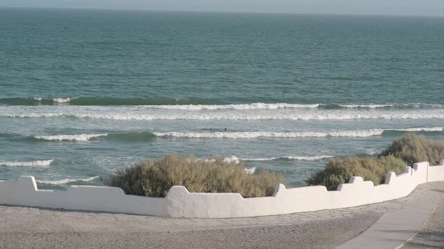 people on the beach, waves, Las Grutas, day