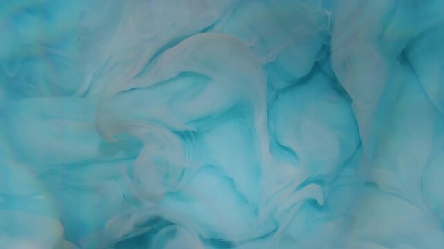 Defocused ink fluid. Fume blue water. Color lens flare cloud splash rainbow texture spreading on abstract acrylic underwater background.