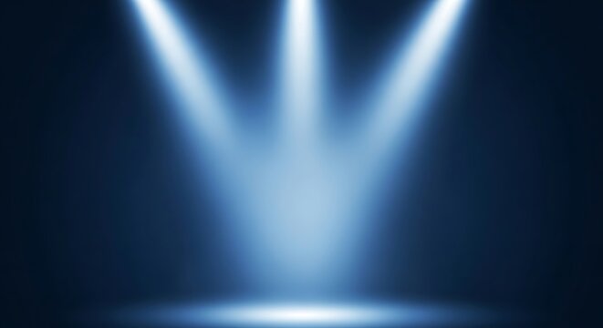 Bright white spotlights illuminating a dark blue stage background with dramatic lighting effects