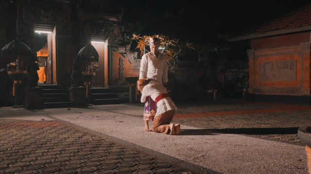 Man Ignoring Woman Clinging to Him at Night