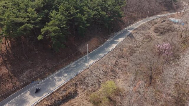 Cinematic motorcycle riding on Riverside Mountain Road with Real engine sound_Wide-angle
