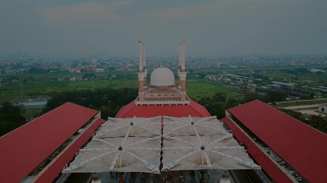 aerial view of the largest grand mosque in Central Java in the morning while people celebrate ied al fit