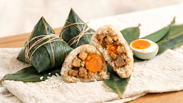 Zongzi (粽子), a traditional Chinese rice dish made of glutinous rice stuffed with a range of fillings and wrapped in bamboo leaves for Dragon Boat Festival