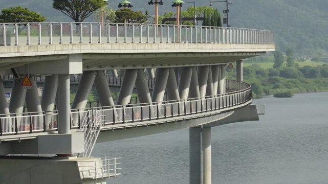 Cyclist Riding a Bicycle on the Lower Deck of Geumgang Pedestrian Bridge in Sejong City, South Korea
