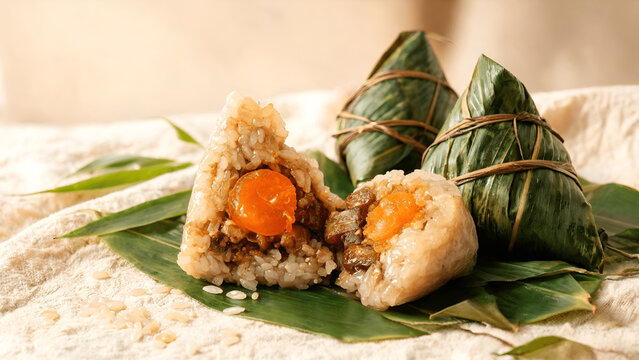 Zongzi (粽子), a traditional Chinese rice dish made of glutinous rice stuffed with a range of fillings and wrapped in bamboo leaves for Dragon Boat Festival