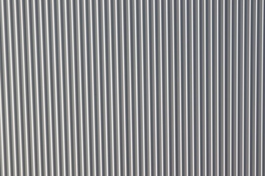 Vertical Grey Metal Cladding Texture with Repeating Architectural Lines