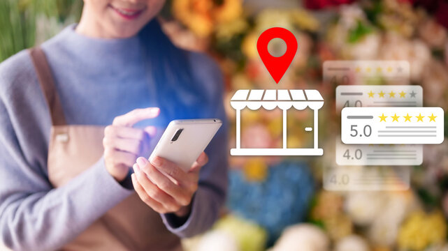 Asian women using smartphone search local business review rating location map pin icon overlay store finder app customer feedback online shopping market