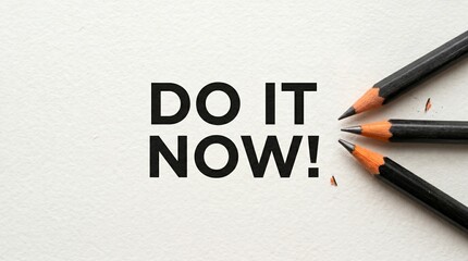 Obraz premium Hand Holding Scissors Cutting Do It Now Text on White Background for Motivation