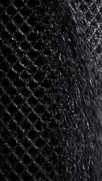 Macro texture of black carbon filter mesh material
