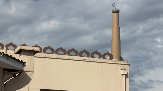 A minaret of a mosque in a Muslim town.