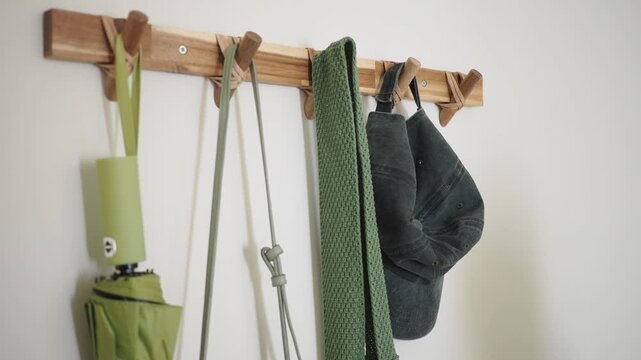 Hat and jacket hanging on a hook in the hallway