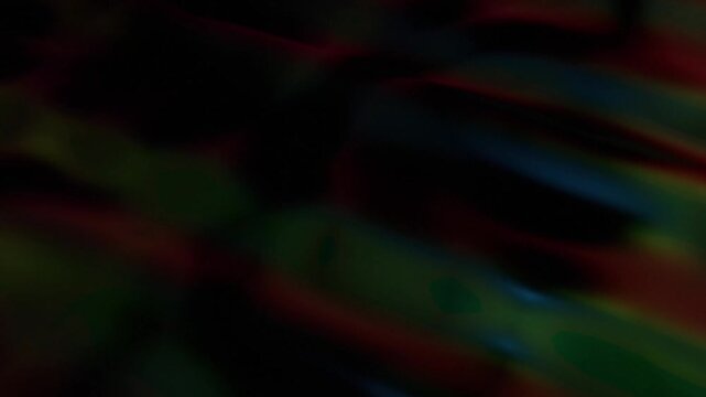 Subtle Dark Abstract Motion Graphics with Blurred Red Blue Green Light Streaks for Ethereal Digital Backgrounds and Mysterious Moods