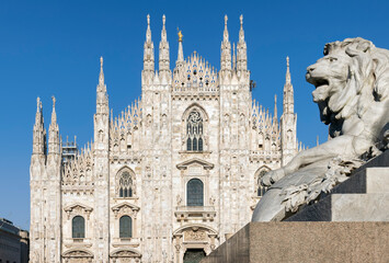 Naklejka premium Milan Cathedral with a lion statue on the foreground.