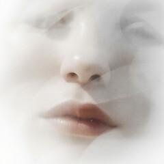 Fototapeta premium an artistic double exposure portrait of a person's face blended softly with white misty textures that create an ethereal and dreamlike effect