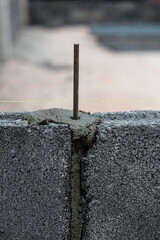 Fototapeta premium Concrete block wall surface with mortar joints for construction work.