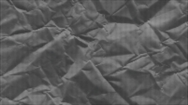 A close-up view of crumpled fabric texture fills the frame.