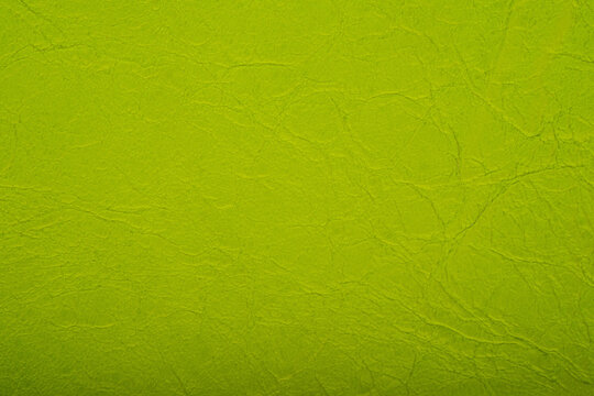 Green leather texture background showing surface details