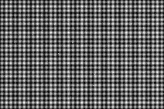 A close-up view of a gray textured surface with small white specks