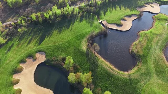 Top view of golf course green and bunkers