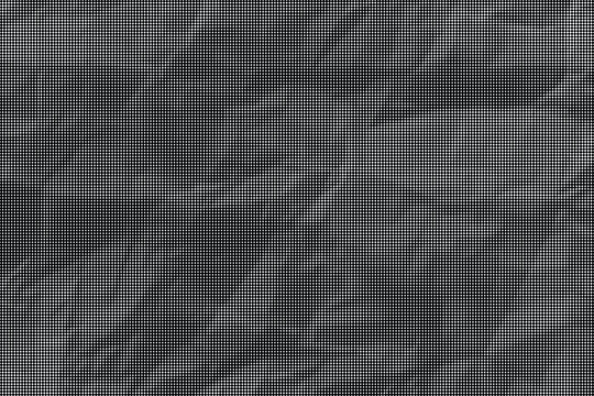 A close-up view of crumpled black paper with deep wrinkles and folds.