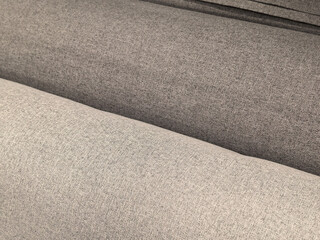 Fototapeta premium Beige and gray linen upholstery fabric close up texture on sofa