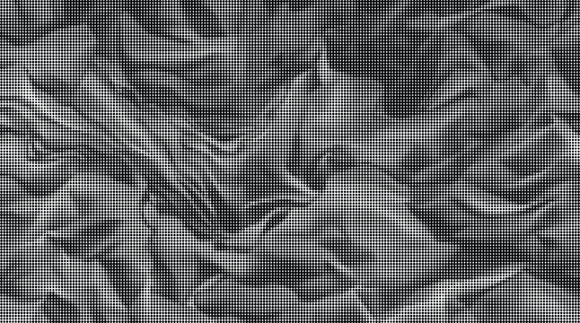 A close-up view of a dark gray wrinkled fabric texture on a flat surface