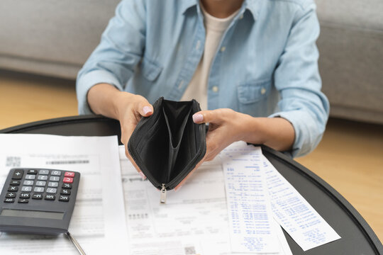 Debt financial concept, stressed problem asian woman hand open empty wallet, purse not have budget of money to pay no have credit card, not able payment bill, loan or expense with bank, bankruptcy.