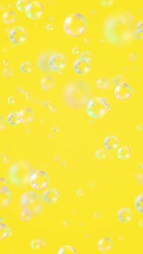 Floating Soap Bubble on yellow background animation,air bubbles cosmetics and cleaning vertical social media motion design element