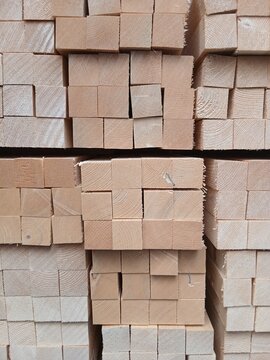Pile of square wood  background - Light wooden bars