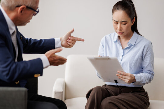 Boss pointing and gesturing accusingly at a sad feeling worker holding a clipboard, representing workplace conflict, bad communication, and an argument