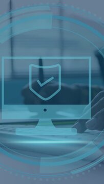 Vertical video: Office worker moving right-hand to keyboard as HUD appearing showing security check