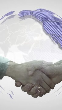 Vertical video: Tech duo shaking hands and starting globe spin around them showing map for deal