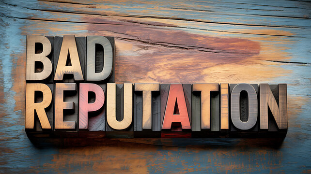 Vintage wooden letterpress blocks spelling BADREPUTATION on a distressed blue and brown wooden background