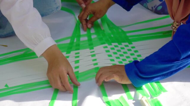 Making woven items using plastic ribbon. Crafts made from recycled materials.