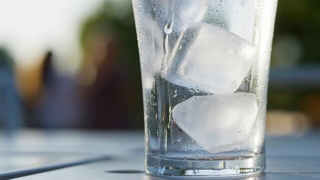 Close up of refreshing glass of ice water outdoors