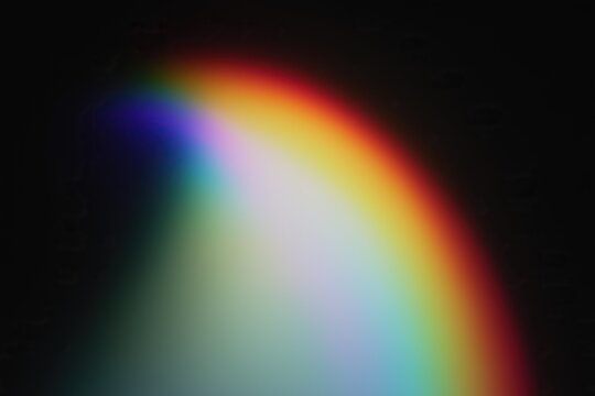 Abstract soft gradient background with vibrant complementary colors blending on a dark backdrop.