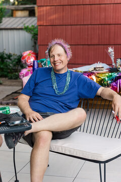 Man Celebrating with Party Decorations Outdoors