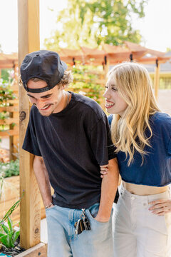 Young couple laughing together outdoors