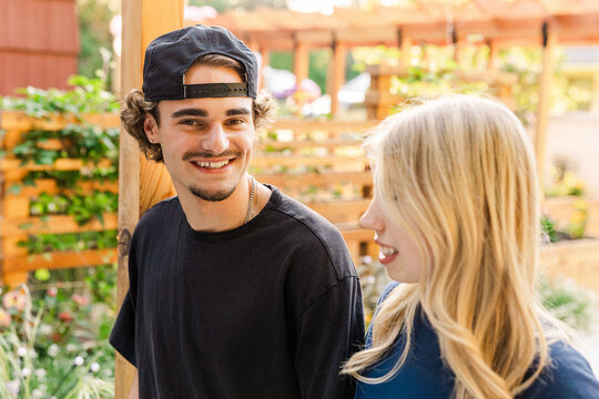 Happy friends talking outdoors in summer