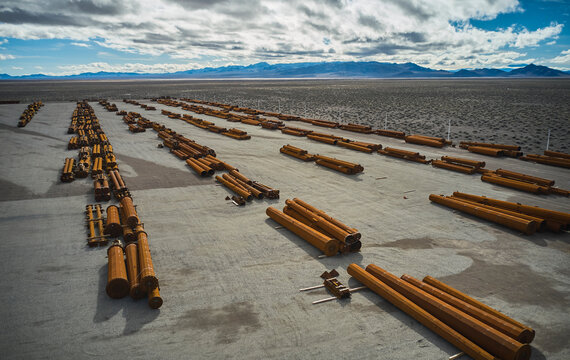 Components of electrical grid transmission lines at staging area