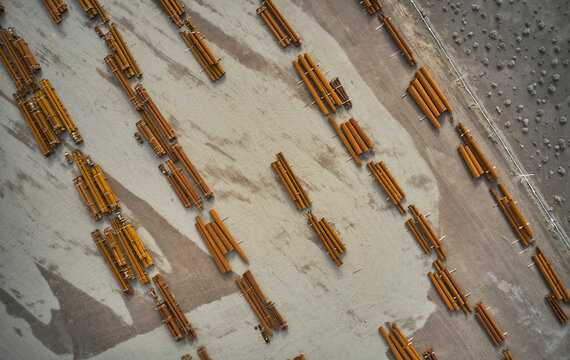Components of electrical grid transmission lines at staging area