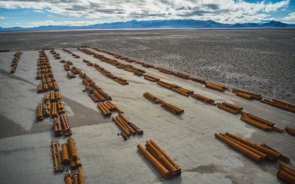 Components of electrical grid transmission lines at staging area