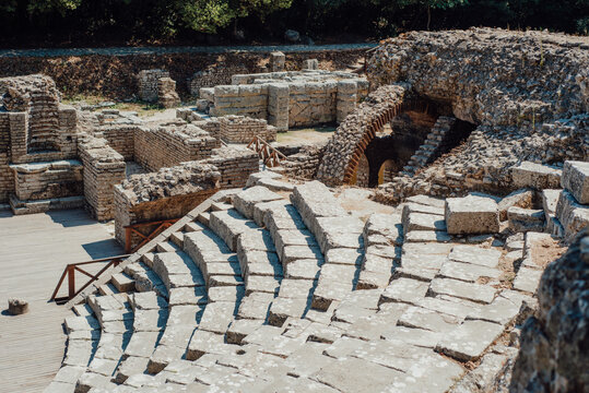 Stone seating and ruins of ancient theater in Butrint, Albania
