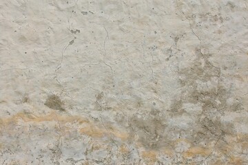 Obraz premium Close-up texture of an old, weathered concrete or plastered wall, Saaremaa, Estonia, Europe.