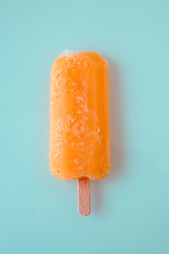Orange ice lolly stick, overhead view