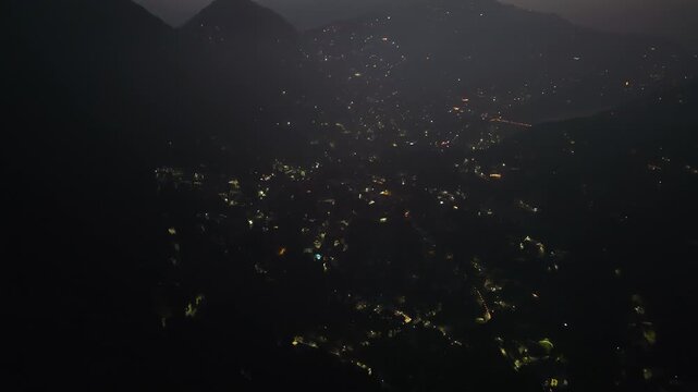 4K cinematic aerial footage of Nainital city during early morning sunrise with vibrant blue skies and Himalayan scenery.