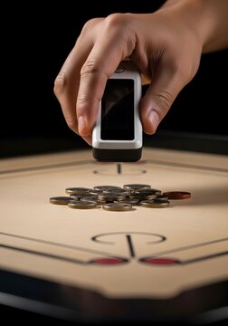 Ai generated image of hand holding digital scanner device over coins on a carrom board
