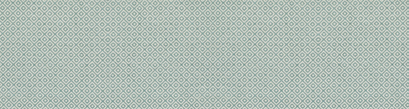 A seamless teal and white geometric diamond pattern on a textured woven fabric background, ideal for interior design and upholstery projects.