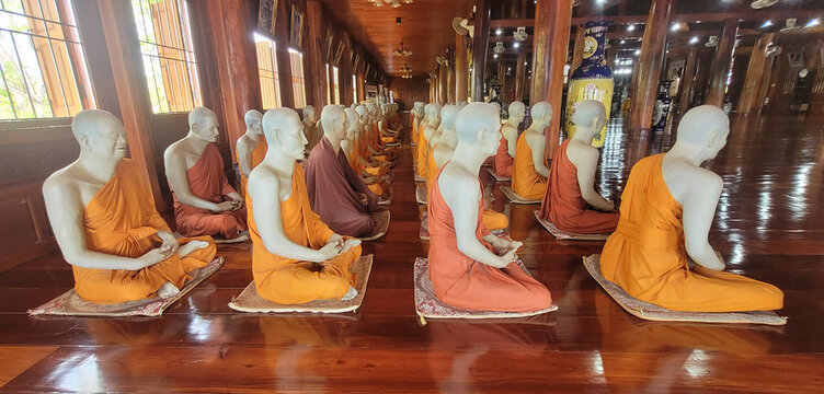Buddhist monks wax.