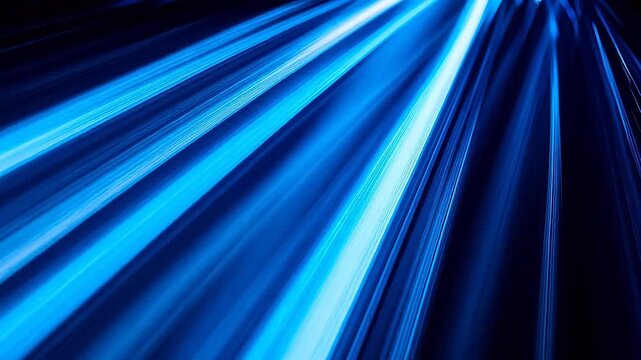 Abstract blue and white radial light rays streaking on dark background with speed effect